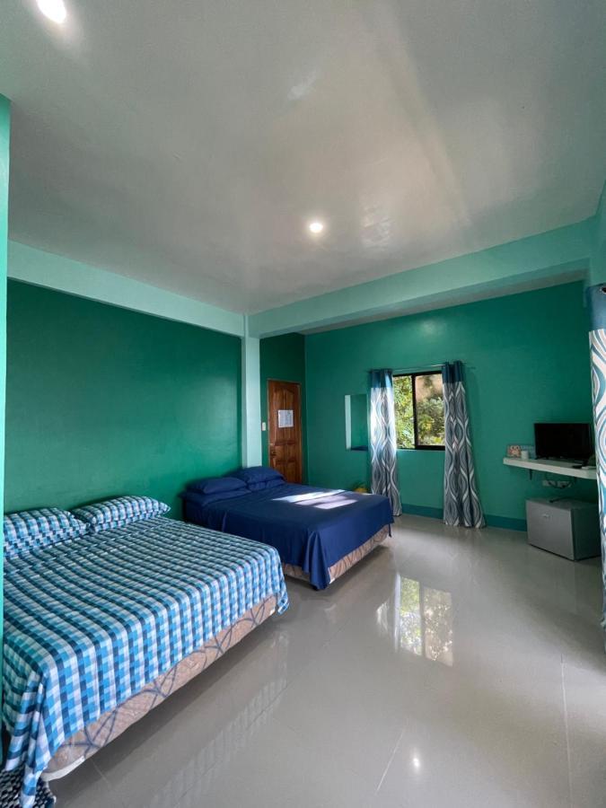 C - Side Inn Mambajao Camera foto